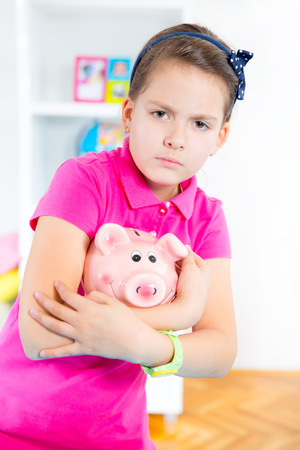 child with piggy bankの写真素材