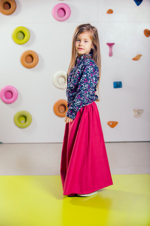 The little girl posing in a playroomの写真素材