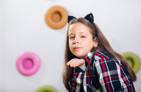 The little girl posing in a playroomの写真素材