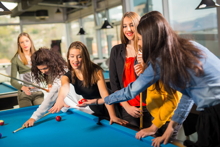 Pool game. group of friends playing pool together.の写真素材
