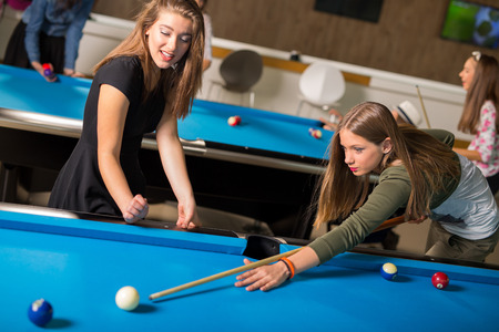 Pool game. group of friends playing pool together.