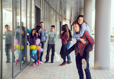 Happy teen girls and boys having good fun time outdoors. Selective focusの写真素材