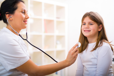 Female doctor and little girl patient.  Medical examination.の写真素材