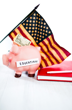 Saving concept. Piggy bank with an inscription education. Selective focusの写真素材