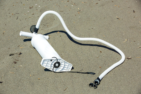Air pump for the kite on the beachの写真素材