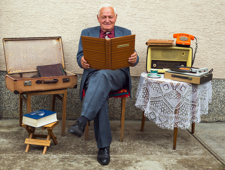 Portrait of smiling elderly old fashion  man outdoorの写真素材
