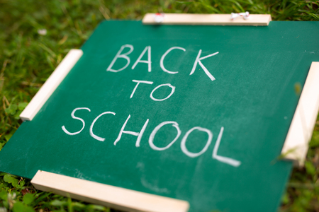 Back to school. Blackboard on the grassの写真素材