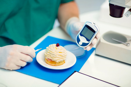 Laboratory testing of glucose to cake, selective focusの写真素材