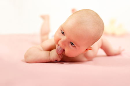Portrait of adorable baby.Baby lying on his stomachの写真素材