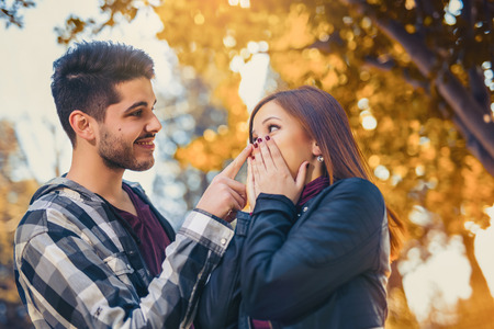 Young couple spends time in the autumn parkの写真素材