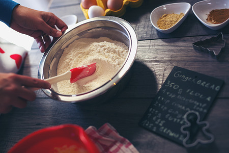 Woman make ginger bread for Christmasの写真素材