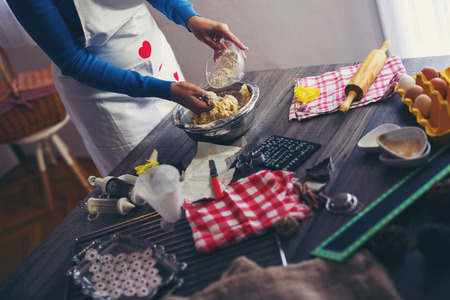Woman make ginger bread for Christmas