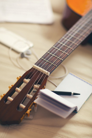 Guitar left on the sofaの写真素材