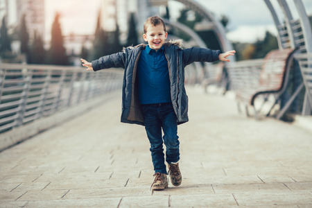 Little child walking on the bridge.の写真素材