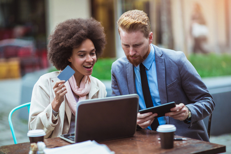 Business people using laptop and credit card outdoor. Business and coworker conceptの写真素材