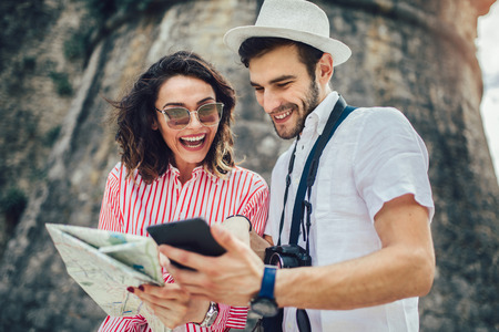 Tourist couple enjoying sightseeing and exploring cityの写真素材
