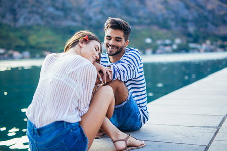 Couple in love, enjoying the summer time by the sea.の写真素材
