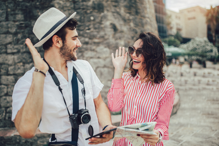 Tourist couple enjoying sightseeing and exploring cityの写真素材