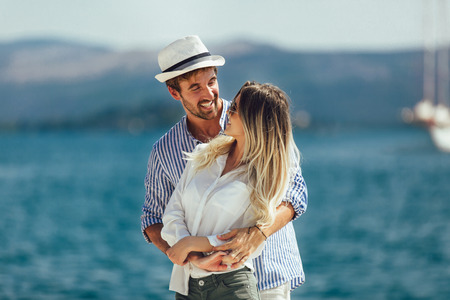 Couple in love, enjoying the summer time by the sea.の写真素材