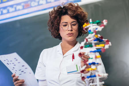 Scientist looking at DNA in laboratory