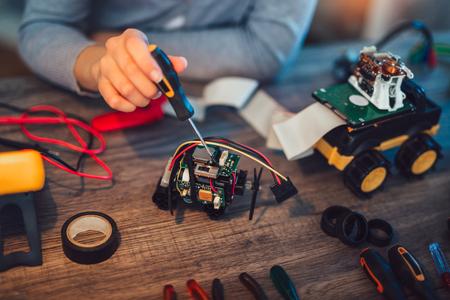 Girl constructs technical toy, close upの写真素材