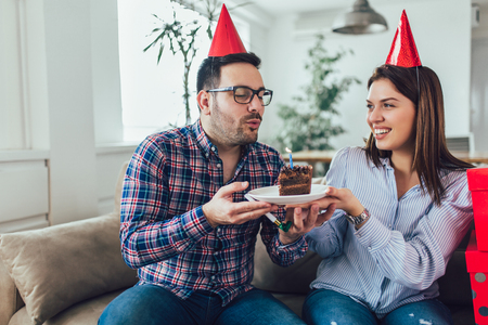 Husband's birthday.Wife surprise his husband with birthday cake .Anniversary.の写真素材