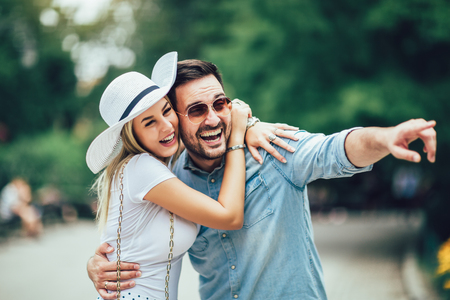 Romantic young couple having fun in the park.の写真素材