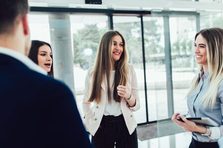 Business partners talking in modern officeの写真素材