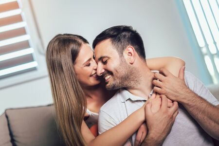 Beautiful couple hugging and looking at each other