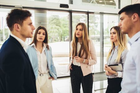 Business partners talking in modern office