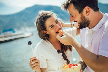 Couple having fun together at the beachの写真素材