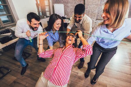 Business people making team training exercise during team building seminar having fun.の写真素材