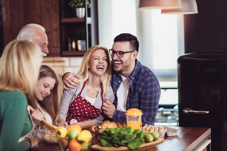 Multi Generation Family Cooking Meal At Homeの写真素材