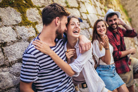 Happy friends enjoying sightseeing tour in the city.
