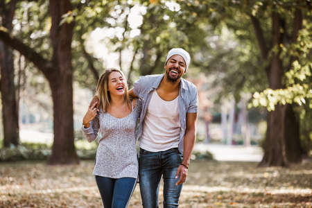 Portrait of happy mixed race couple in walking.の写真素材