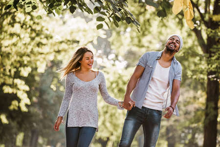 Portrait of happy mixed race couple in walking.の写真素材
