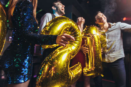 New year party celebration with friends in the clubの写真素材