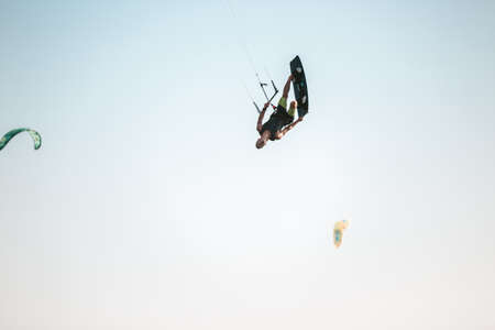 Kitesurfing Kiteboarding action photos man among waves quickly goesの写真素材