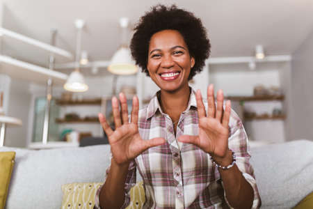Portrait african american woman gesturing with hands.の写真素材