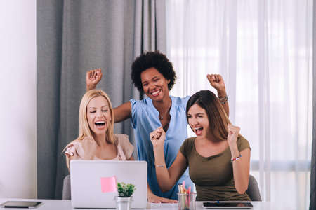 Beautiful young businesswomen working together in officeの写真素材