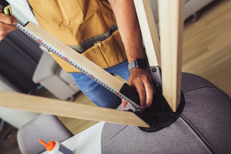 Craftsman with Tools Repairs Chair.の写真素材