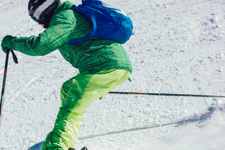 Skier in mountains. Professional skier athlete skiing of ski resort.Winter vacation and sport concept.の写真素材