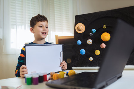 Kid presenting his science home project - the planets of our solar system. Distance learning online...