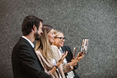 Business people looking at screen during video conferenceの写真素材