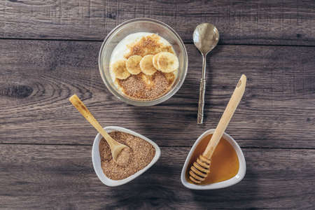 Fresh yogurt with wheat bran and bananaの写真素材