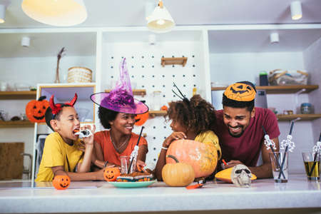 Family has fun in Halloween timeの写真素材