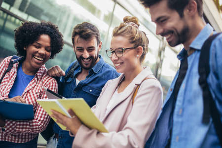College students studying on university campus outdoorの写真素材