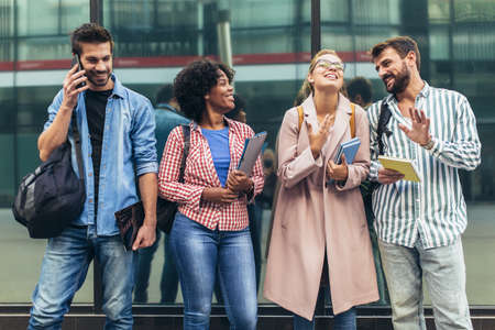 College students studying on university campus outdoorの写真素材