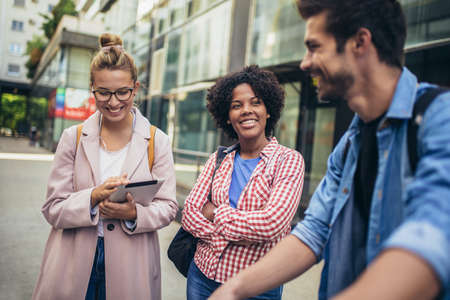 College students studying on university campus outdoorの写真素材