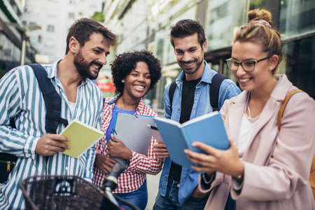 College students studying on university campus outdoorの写真素材